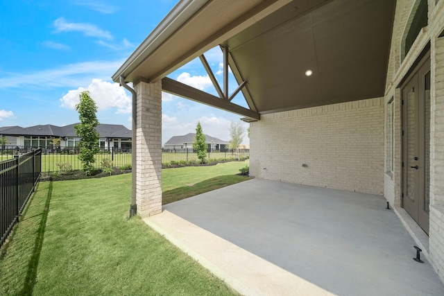 9975 Monarch Landing Cv, Willis, TX 77318 - fenced backyard featuring a residential view and a patio area