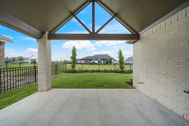 9975 Monarch Landing Cv, Willis, TX 77318 - view of patio / terrace featuring a residential view
