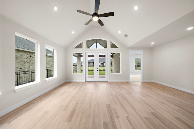 9975 Monarch Landing Cv, Willis, TX 77318 - unfurnished living room featuring ceiling fan, light wood-type flooring, baseboards, recessed lighting, and lofted ceiling