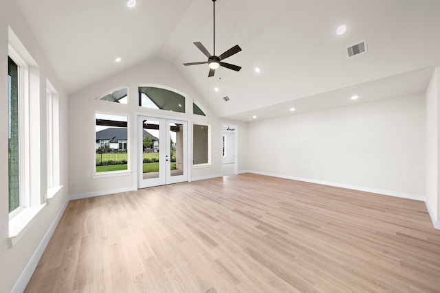 9975 Monarch Landing Cv, Willis, TX 77318 - unfurnished living room featuring a ceiling fan, light wood-style floors, recessed lighting, baseboards, and high vaulted ceiling