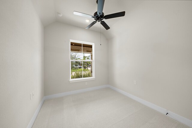 9975 Monarch Landing Cv, Willis, TX 77318 - spare room with ceiling fan, vaulted ceiling, light carpet, baseboards, and a smoke detector