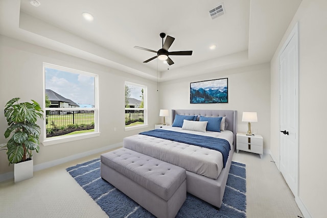 9975 Monarch Landing Cv, Willis, TX 77318 - bedroom featuring a raised ceiling, carpet flooring, a ceiling fan, and recessed lighting