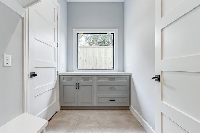 bathroom with tile patterned floors and baseboards