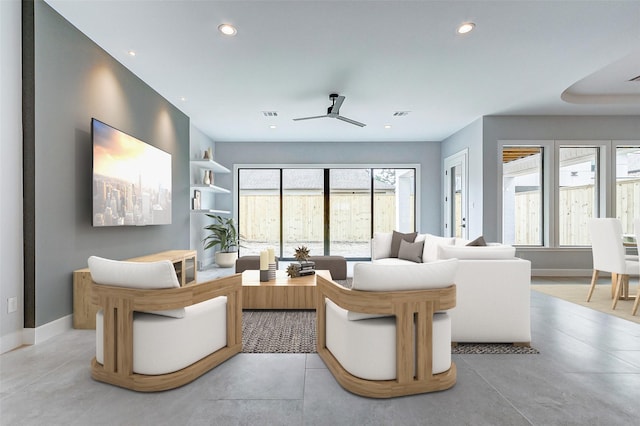 living room with baseboards, visible vents, a ceiling fan, and recessed lighting