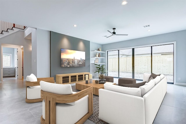 living room featuring recessed lighting, ceiling fan, and baseboards