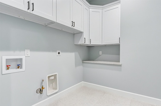 washroom featuring hookup for an electric dryer, hookup for a gas dryer, washer hookup, baseboards, and cabinet space