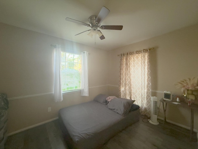 bedroom with baseboards and ceiling fan