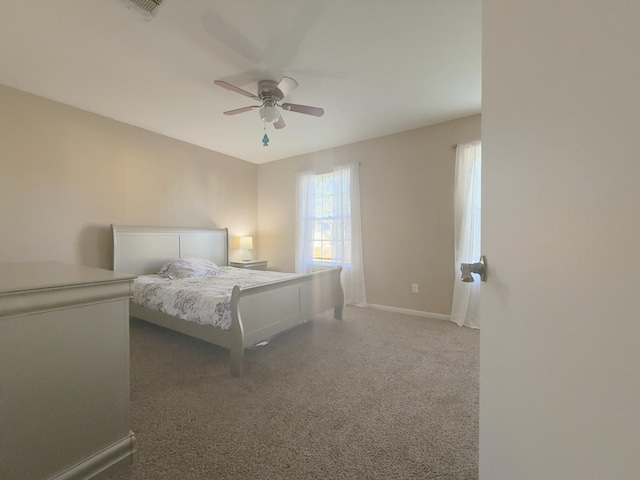 bedroom with baseboards, a ceiling fan, and carpet floors