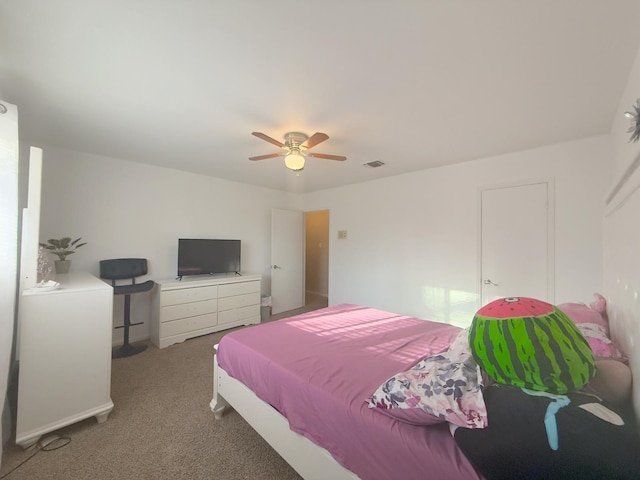 bedroom with a ceiling fan, visible vents, and carpet floors