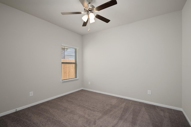 unfurnished room featuring ceiling fan, baseboards, and dark colored carpet