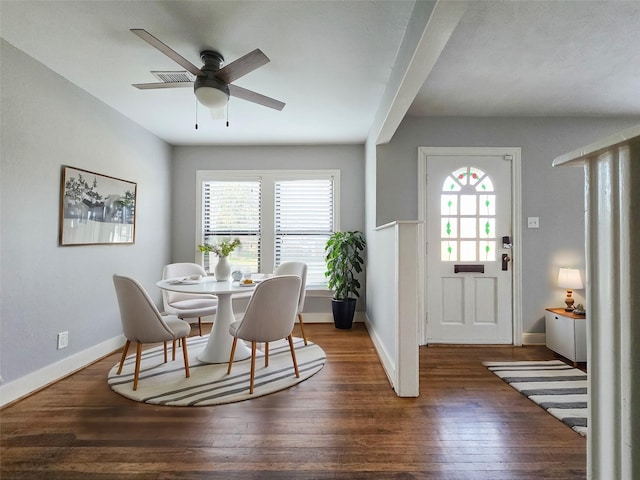 dining area with ceiling fan, baseboards, and hardwood / wood-style flooring