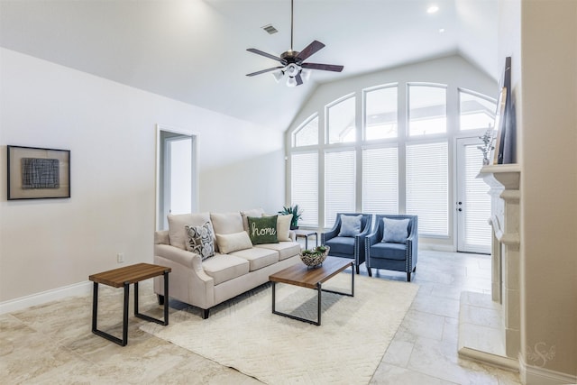 living area with a ceiling fan, baseboards, vaulted ceiling, and visible vents