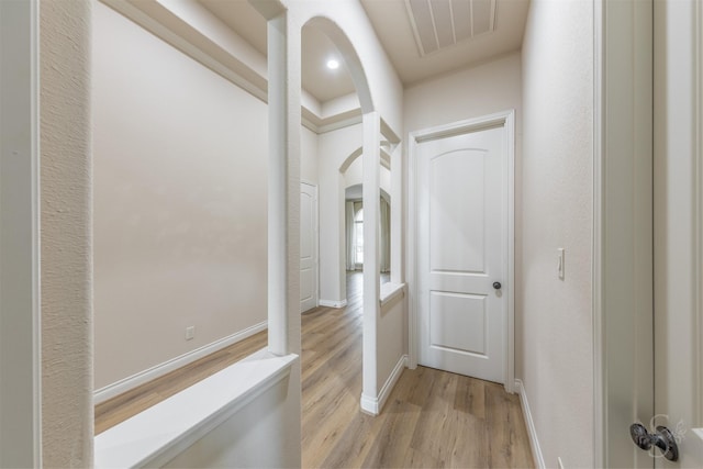4903 Cancun Hills Ct, Fulshear, TX 77441 - corridor with light wood-type flooring and arched walkways