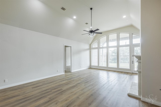 4903 Cancun Hills Ct, Fulshear, TX 77441 - unfurnished living room with ceiling fan, lofted ceiling, light wood-style floors, and recessed lighting