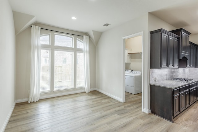 4903 Cancun Hills Ct, Fulshear, TX 77441 - kitchen featuring separate washer and dryer, healthy amount of natural light, light wood finished floors, and recessed lighting