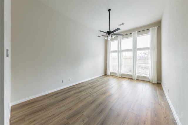 4903 Cancun Hills Ct, Fulshear, TX 77441 - empty room with light wood-style floors and a ceiling fan