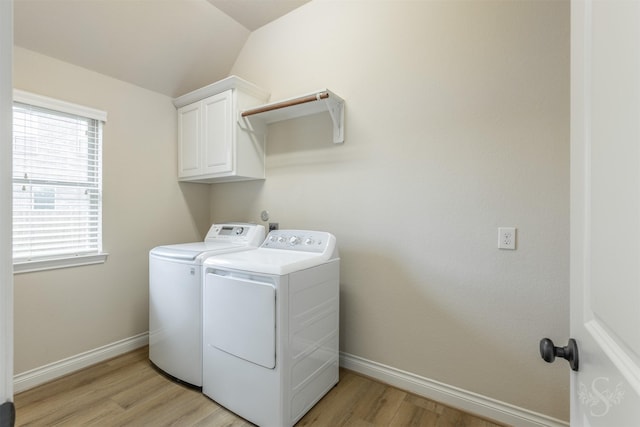 4903 Cancun Hills Ct, Fulshear, TX 77441 - washroom with separate washer and dryer, cabinet space, and light wood finished floors
