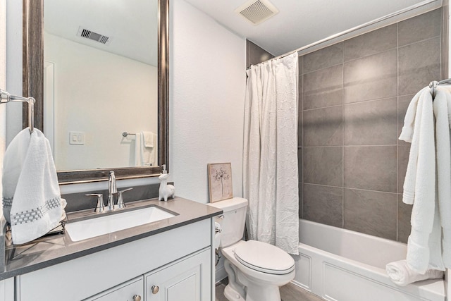 bathroom featuring toilet, visible vents, shower / bath combination with curtain, and vanity