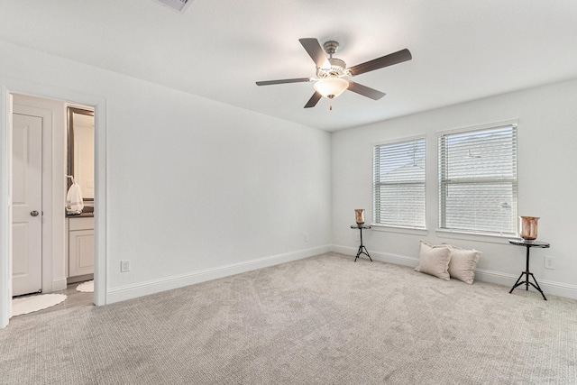 unfurnished room with ceiling fan, baseboards, and carpet flooring