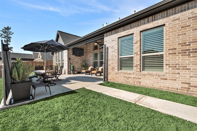 view of patio featuring fence