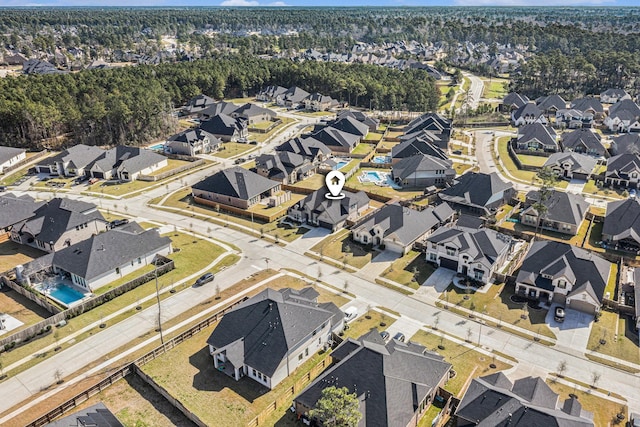 birds eye view of property with a residential view