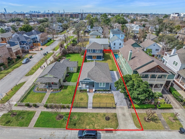 birds eye view of property with a residential view