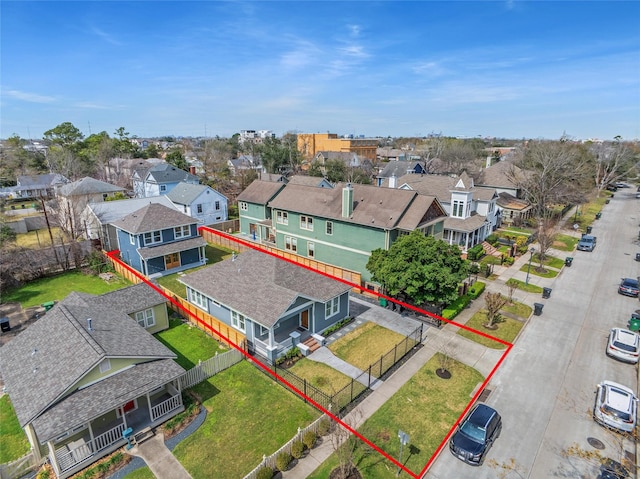 birds eye view of property with a residential view