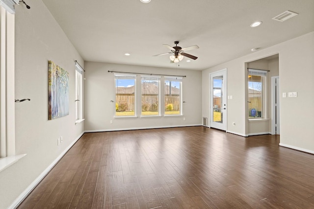 unfurnished room featuring dark wood-style floors, recessed lighting, visible vents, ceiling fan, and baseboards