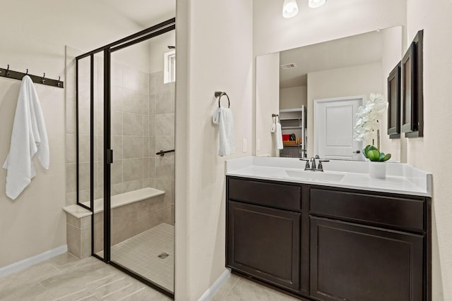 full bath featuring a stall shower, tile patterned flooring, visible vents, and vanity