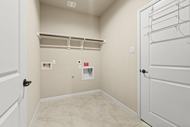 clothes washing area featuring hookup for a washing machine, hookup for an electric dryer, gas dryer hookup, laundry area, and baseboards