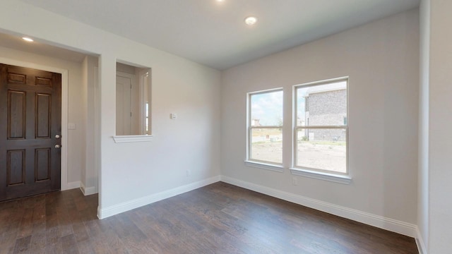 2011 Sunflower Ct, Sugar Land, TX 77498 - spare room featuring dark wood-type flooring, baseboards, and recessed lighting