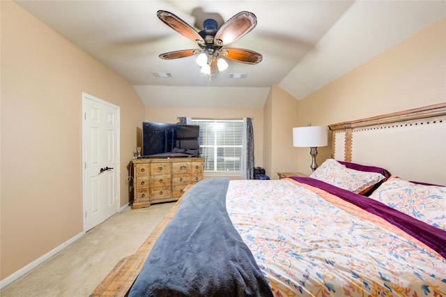 bedroom featuring vaulted ceiling, carpet floors, and visible vents