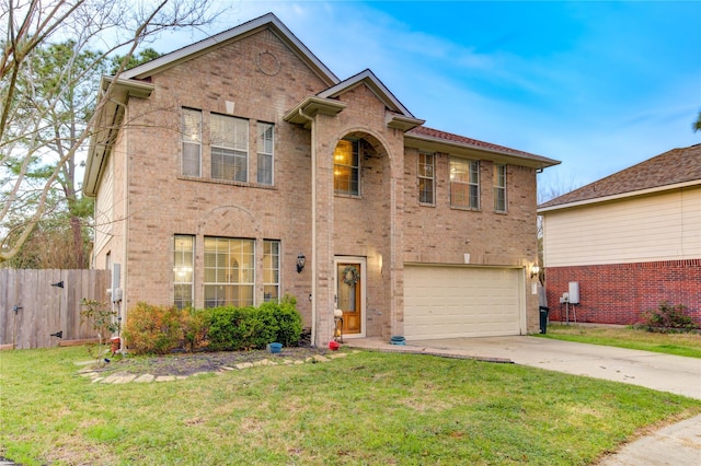 traditional home with concrete driveway, an attached garage, fence, a front lawn, and brick siding