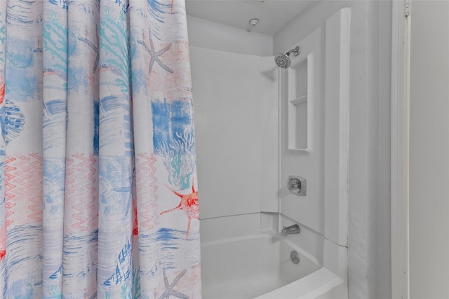 bathroom featuring shower / bathtub combination with curtain