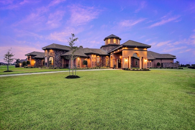 view of front of home with a lawn