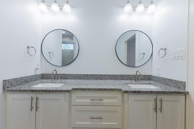 full bath with double vanity and a sink