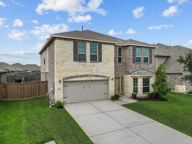 traditional-style home featuring driveway, stone siding, fence, and a front lawn