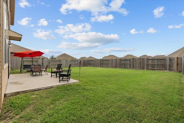 view of yard featuring a patio area and a fenced backyard