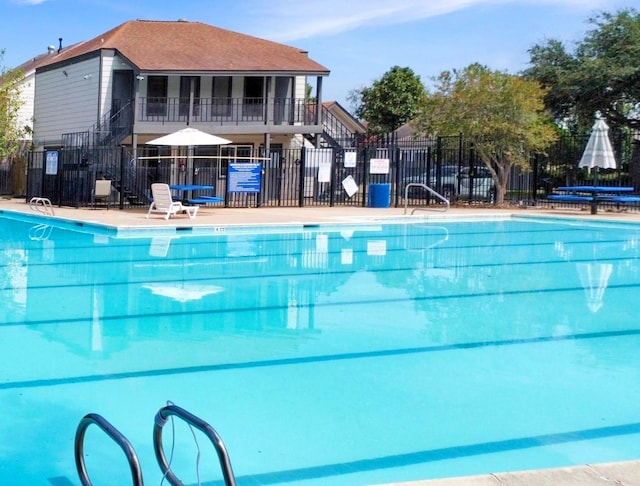 community pool featuring fence