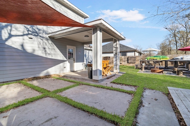 view of yard with fence and a patio