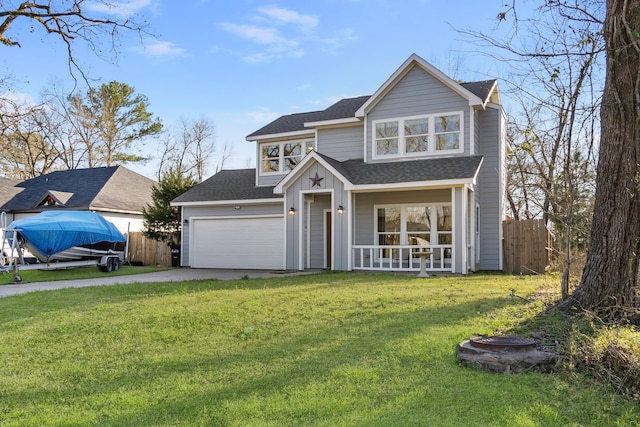 view of front facade with an attached garage, fence, a front lawn, and concrete driveway