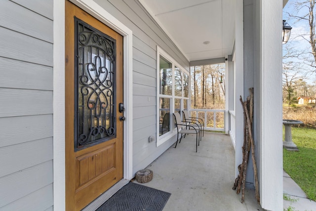 doorway to property featuring covered porch