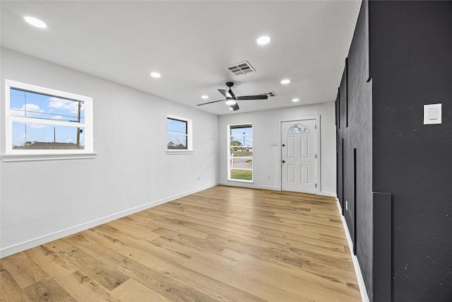 entryway featuring visible vents, recessed lighting, light wood-type flooring, and baseboards