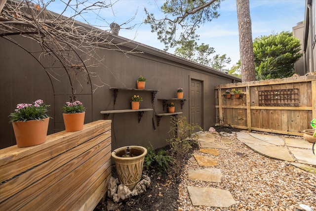 view of side of home with fence