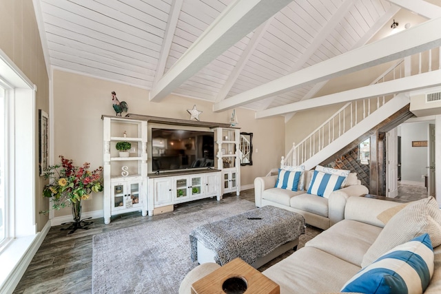 living area with vaulted ceiling with beams, stairs, baseboards, and wood finished floors