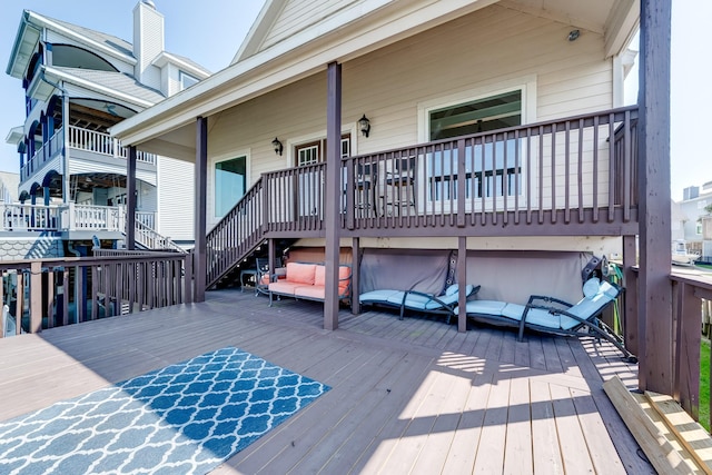 wooden terrace featuring stairway