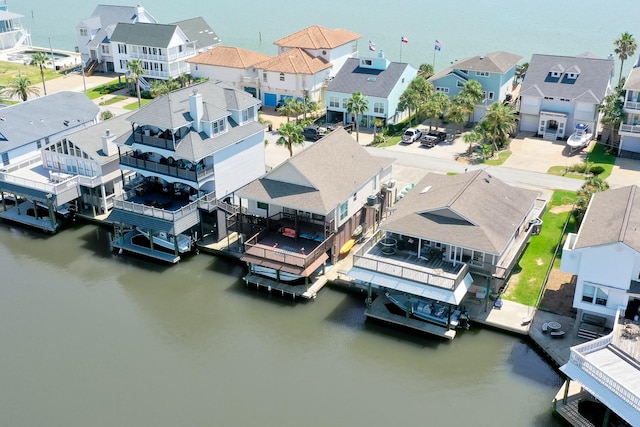 bird's eye view featuring a water view and a residential view