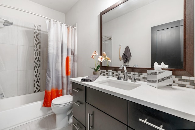 bathroom with toilet, shower / tub combo with curtain, and vanity