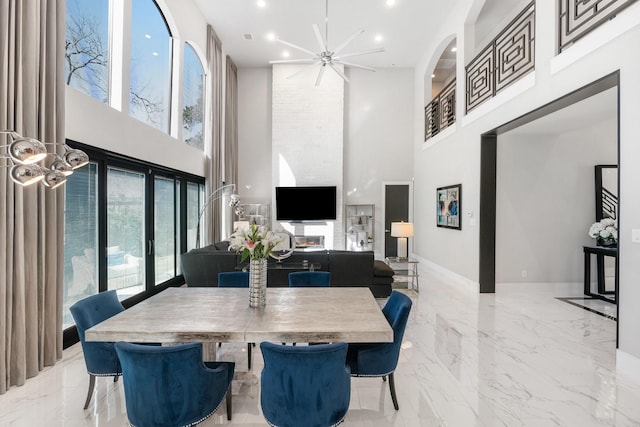 dining room with marble finish floor, recessed lighting, and a healthy amount of sunlight