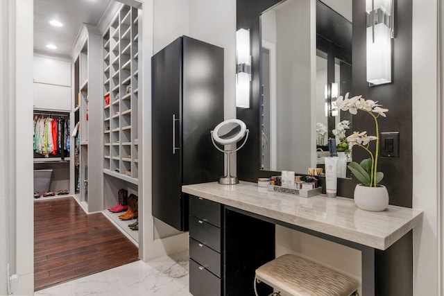 spacious closet with marble finish floor